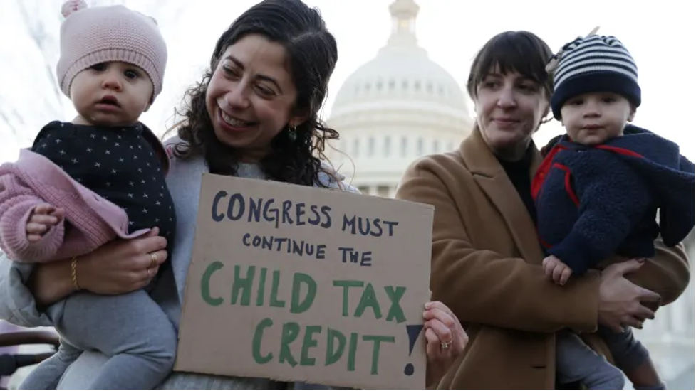 Cara Baldari and her 9-month-old daughter Evie (left) and Sarah Orrin-Vipond and her 8-month-old son Otto (right), join a rally in front of the U.S. Capitol on Dec. 13, 2021, in Washington, D.C. (Photo: Alex Wong via Getty Images)