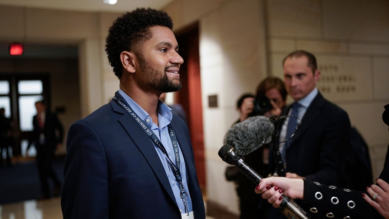 Rep.-elect Maxwell Frost, D-Fla., speaks with reporters as newly-elected members of the House of Representatives arrive at the Capitol for an orientation program in Washington, Monday, Nov. 14, 2022 (AP Photo/J. Scott Applewhite)