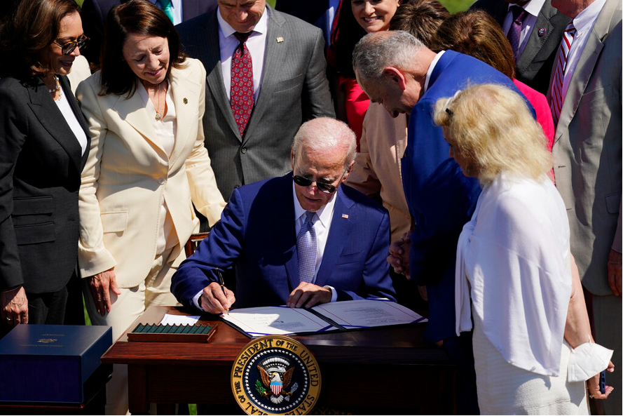 President Joe Biden signs into law H.R. 4346, the CHIPS and Science Act of 2022, at the White House in Washington, Aug. 9, 2022. (AP Photo/Carolyn Kaster)